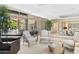 Bright and airy living room featuring floor-to-ceiling windows with a glimpse of the pool area at 7272 N 71St St, Paradise Valley, AZ 85253