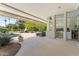 The outdoor patio features dining table and fireplace, with pool view at 7272 N 71St St, Paradise Valley, AZ 85253