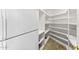 Spacious white pantry with shelving for organized storage and convenience at 7272 N 71St St, Paradise Valley, AZ 85253