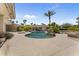 Backyard swimming pool with surrounding lush landscaping and mature palm trees at 7272 N 71St St, Paradise Valley, AZ 85253