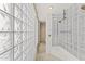 Modern shower design featuring glass blocks and a stylish bronze shower head at 7272 N 71St St, Paradise Valley, AZ 85253