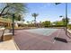 Beautifully maintained tennis court with basketball hoops near the home for sports and recreation at 7272 N 71St St, Paradise Valley, AZ 85253