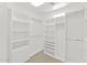 Walk-in closet with built-in shelving and clothing rods at 7272 N 71St St, Paradise Valley, AZ 85253