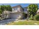 Charming two-story home featuring a two-car garage, balcony, and well-maintained landscaping at 7296 E San Alfredo Dr, Scottsdale, AZ 85258