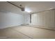Spacious garage features built-in storage cabinets and painted flooring at 7296 E San Alfredo Dr, Scottsdale, AZ 85258