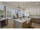Stylish kitchen features an island, a farmhouse sink, and stainless steel appliances at 7296 E San Alfredo Dr, Scottsdale, AZ 85258