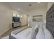 Bright and airy main bedroom with an art piece, a TV, and neutral decor at 7296 E San Alfredo Dr, Scottsdale, AZ 85258