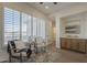 Comfortable sitting room with large windows, shutters, and neutral furniture creates a relaxing space at 7296 E San Alfredo Dr, Scottsdale, AZ 85258