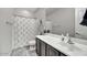 Well-lit bathroom features a clean vanity with a modern sink and minimalist decor at 7407 E Portobello Ave, Mesa, AZ 85212