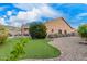 Expansive backyard featuring a putting green, desert landscaping and patio at 7754 E Wolf Canyon St, Mesa, AZ 85207