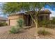 Charming single-story home with desert landscaping and a two-car garage at 7754 E Wolf Canyon St, Mesa, AZ 85207