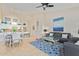 Open-concept living space features a comfortable seating area with a large kitchen island at 7754 E Wolf Canyon St, Mesa, AZ 85207