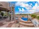 Beautiful pool area with a spiral staircase, patio dining set, and a built-in jacuzzi at 7754 E Wolf Canyon St, Mesa, AZ 85207