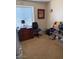 Bedroom features a neutral color palette, a large window, and ample space for furniture and decor at 7901 W Tuckey Ln, Glendale, AZ 85303