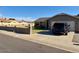Charming single-story home with a driveway and a car parked outside the garage at 7901 W Tuckey Ln, Glendale, AZ 85303