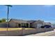Charming single-story home featuring a low-walled front yard and a two-car garage at 7901 W Tuckey Ln, Glendale, AZ 85303
