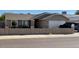 Charming single-story home featuring a low-walled front yard and a two-car garage at 7901 W Tuckey Ln, Glendale, AZ 85303