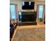A bright living area highlighting a decorative fireplace and tile flooring at 7901 W Tuckey Ln, Glendale, AZ 85303