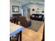 A neutral living room with tile flooring and contemporary furnishings at 7901 W Tuckey Ln, Glendale, AZ 85303