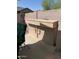 Outdoor kitchen and bar area features concrete counters, a built-in grill, and a seating area at 7901 W Tuckey Ln, Glendale, AZ 85303