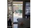 An outdoor view from inside the dining area looking at the patio with table and chairs at 7901 W Tuckey Ln, Glendale, AZ 85303