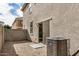 Small backyard with rock landscaping and a home with a sliding glass door at 829 E Agua Fria Ln, Avondale, AZ 85323
