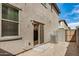 Small backyard with rock landscaping, patio, and air conditioning unit at 829 E Agua Fria Ln, Avondale, AZ 85323