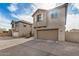 Exterior view of a two-story home with a garage and driveway at 829 E Agua Fria Ln, Avondale, AZ 85323