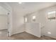 Carpeted hallway space with three windows allowing for plenty of natural light at 829 E Agua Fria Ln, Avondale, AZ 85323