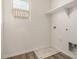 Utility room with shelving, window, and connections for a washer and dryer at 829 E Agua Fria Ln, Avondale, AZ 85323