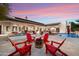 Spacious backyard retreat features a fire pit, ample lounge seating, a pool, and a spa at 8515 E Sutton Dr, Scottsdale, AZ 85260