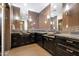 Elegant bathroom featuring dual vanities, granite countertops, decorative tile, and modern fixtures for a luxurious feel at 8515 E Sutton Dr, Scottsdale, AZ 85260