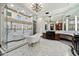 Luxurious bathroom with standalone tub, marble flooring, and spacious walk-in shower at 8515 E Sutton Dr, Scottsdale, AZ 85260