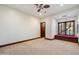 Bedroom with neutral carpet and window seat beneath a window at 8515 E Sutton Dr, Scottsdale, AZ 85260
