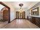 Spacious dining room with a decorative chandelier and hardwood flooring at 8515 E Sutton Dr, Scottsdale, AZ 85260