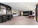 A bar and pool table enhance this rec room, perfect for entertaining and relaxation at 8515 E Sutton Dr, Scottsdale, AZ 85260