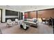 Spacious game room including a basketball court, pool table, sofa, chairs, and a wet bar for recreation and relaxation at 8515 E Sutton Dr, Scottsdale, AZ 85260