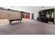 Spacious game room with a bar, pool table, and indoor basketball court for recreation at 8515 E Sutton Dr, Scottsdale, AZ 85260