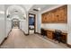 Bright hallway with wood floors, arched doorways, and a view into a bedroom at 8515 E Sutton Dr, Scottsdale, AZ 85260