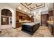 Elegant kitchen featuring marble countertops, custom cabinets, and an open layout to living areas at 8515 E Sutton Dr, Scottsdale, AZ 85260