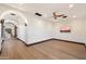Living room showcasing hardwood flooring, vaulted ceilings, and a mounted TV at 8515 E Sutton Dr, Scottsdale, AZ 85260