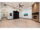 Living room showcasing hardwood floors, fireplace, and archway at 8515 E Sutton Dr, Scottsdale, AZ 85260