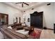 Comfortable living area with sectional seating, an area rug, and access to adjacent rooms at 8515 E Sutton Dr, Scottsdale, AZ 85260