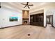 Living room with hardwood flooring, fireplace and built-in shelves at 8515 E Sutton Dr, Scottsdale, AZ 85260