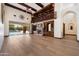 Elegant living room boasts a cozy fireplace, custom built-ins, and access to the outdoor pool area at 8515 E Sutton Dr, Scottsdale, AZ 85260
