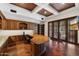 Office featuring custom wood desk, cabinetry, and hardwood floors at 8515 E Sutton Dr, Scottsdale, AZ 85260