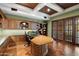 Elegant office features custom wood built-ins, herringbone wood flooring, and a large desk at 8515 E Sutton Dr, Scottsdale, AZ 85260