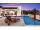 Stunning outdoor space features a large pool, water fountains, and comfortable chaise lounge seating at 8515 E Sutton Dr, Scottsdale, AZ 85260