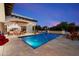 Gorgeous pool area featuring a barbecue, covered patio, water features, and comfortable seating at 8515 E Sutton Dr, Scottsdale, AZ 85260