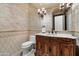 Chic powder room featuring a unique vanity with marble countertop, stylish lighting, and designer details for guests at 8515 E Sutton Dr, Scottsdale, AZ 85260
